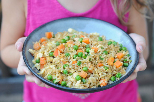Get your kids in the kitchen by making this simple kid-friendly fried rice. Using leftover rice makes it even quicker! 