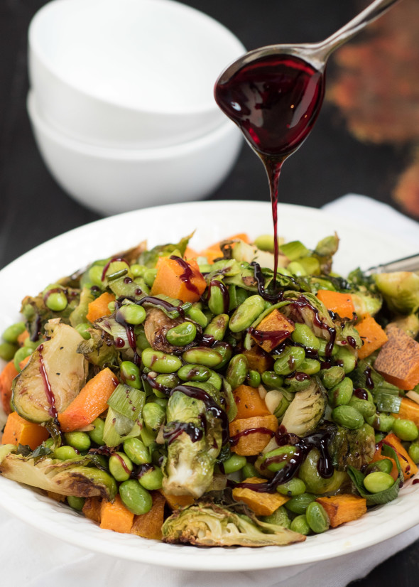 Roasted Edamame, Squash and Brussels Sprouts with Pomegranate Molasses- the perfect veggie side to bring to the Holiday table | Nutritious Eats
