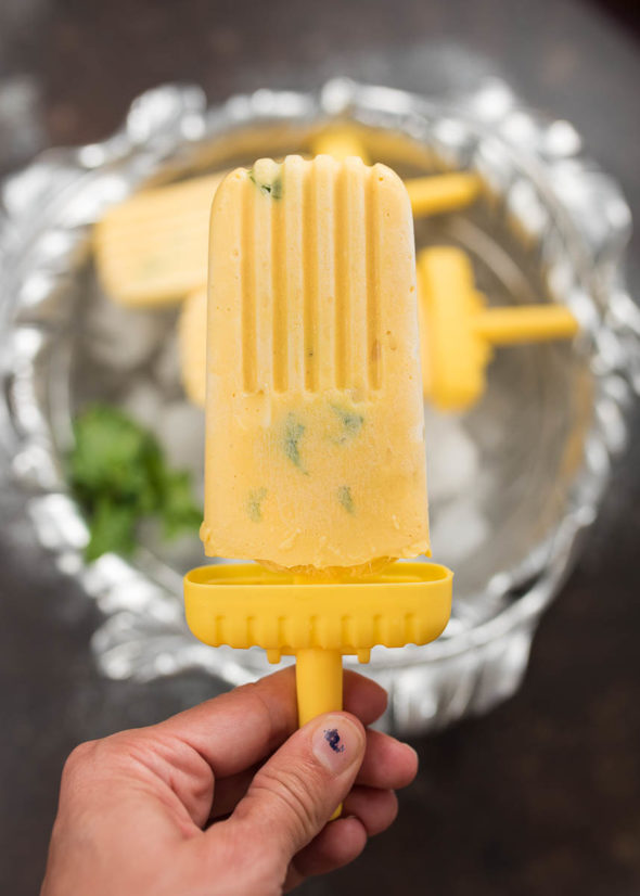 Creamy Minty Mango Popsicles- these lower sugar, simple 4 ingredient pops can be assembled in minutes and make a healthy treat! | www.nutritiouseats.com