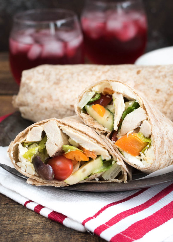 Mediterranean Chicken Wrap- Greek Salad, hummus and seasoned chicken make up this tasty wrap. Great for leftovers or a make-ahead meal! | www.nutritiouseats.com