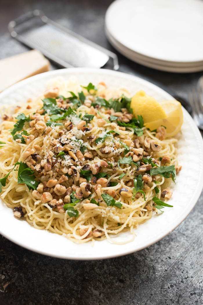 Lemon and Walnut Angel Hair Pasta- ready in less than 15 minutes + vegetarian. A simple weeknight side! | www.nutritiouseats.com
