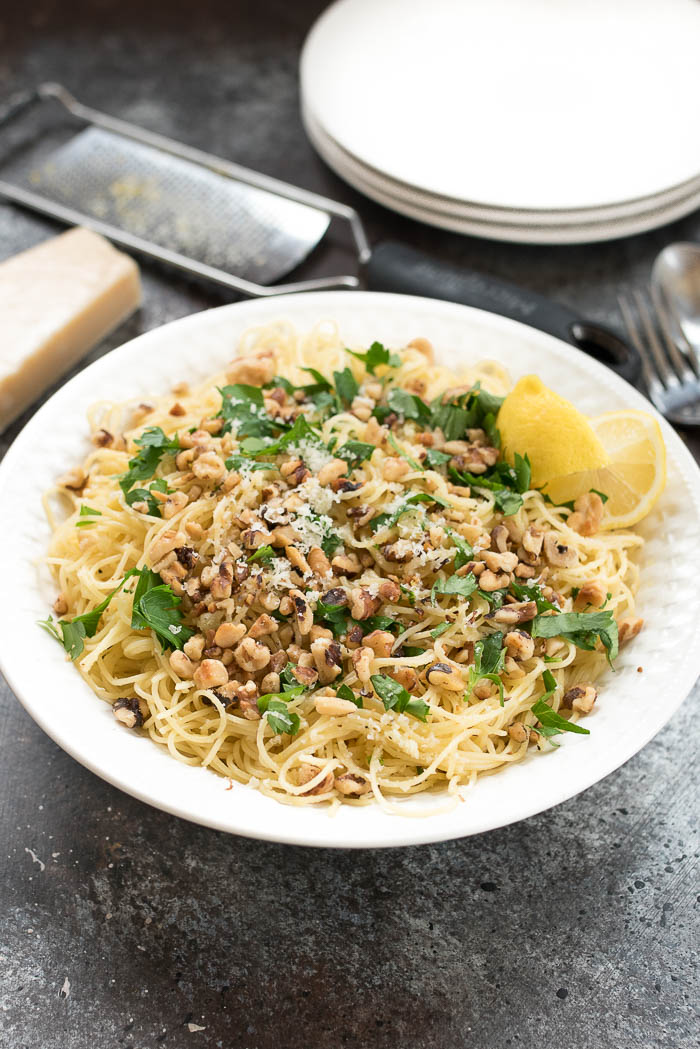 Lemon and Walnut Angel Hair Pasta- ready in less than 15 minutes + vegetarian. A simple weeknight side! | www.nutritiouseats.com