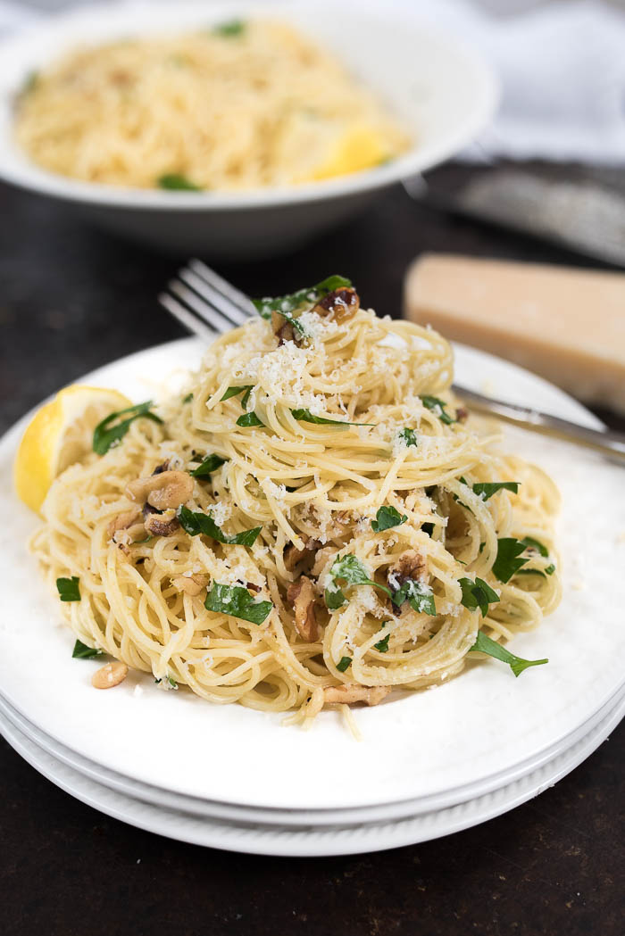 Lemon and Walnut Angel Hair Pasta- ready in less than 15 minutes + vegetarian. A simple weeknight side! | www.nutritiouseats.com