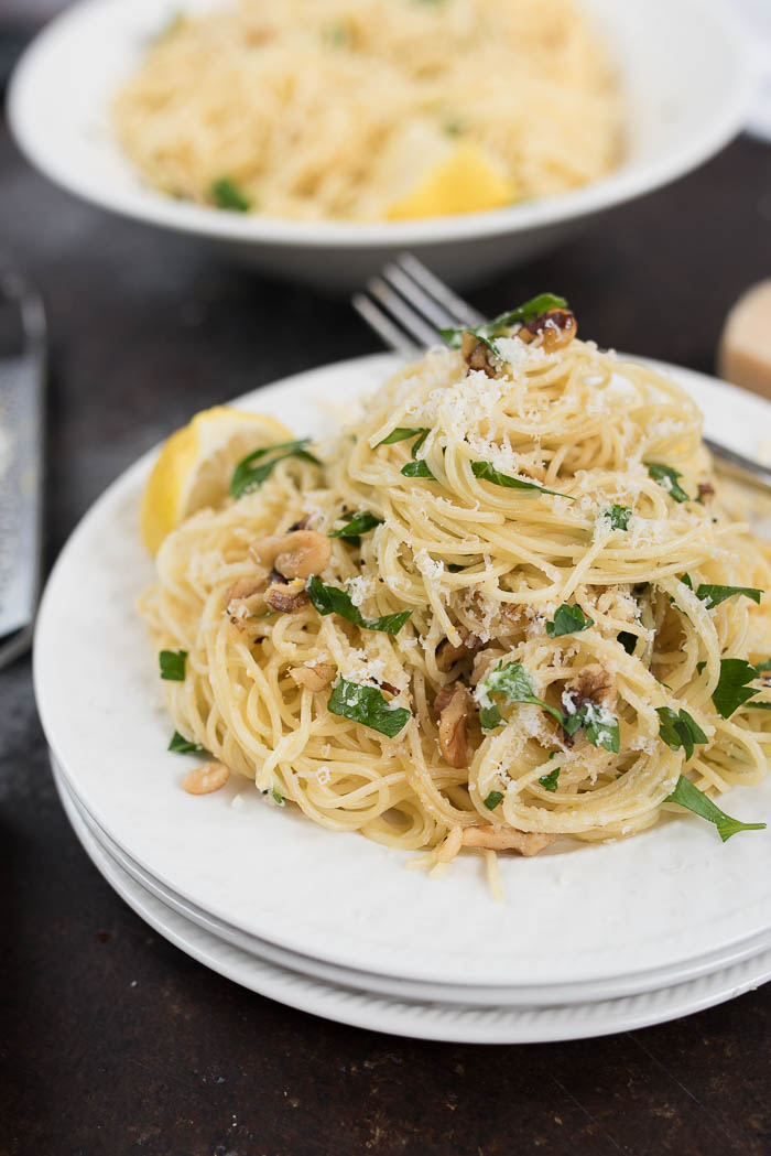 Lemon and Walnut Angel Hair Pasta- ready in less than 15 minutes + vegetarian. A simple weeknight side! | www.nutritiouseats.com