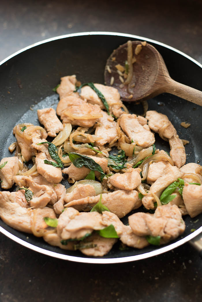 Spicy Thai Basil Chicken | super simple, flavorful and ready in under 20 minutes! You don' have to be an experienced Thai cook to make this Thai inspired dish! | www.nutritiouseats.com