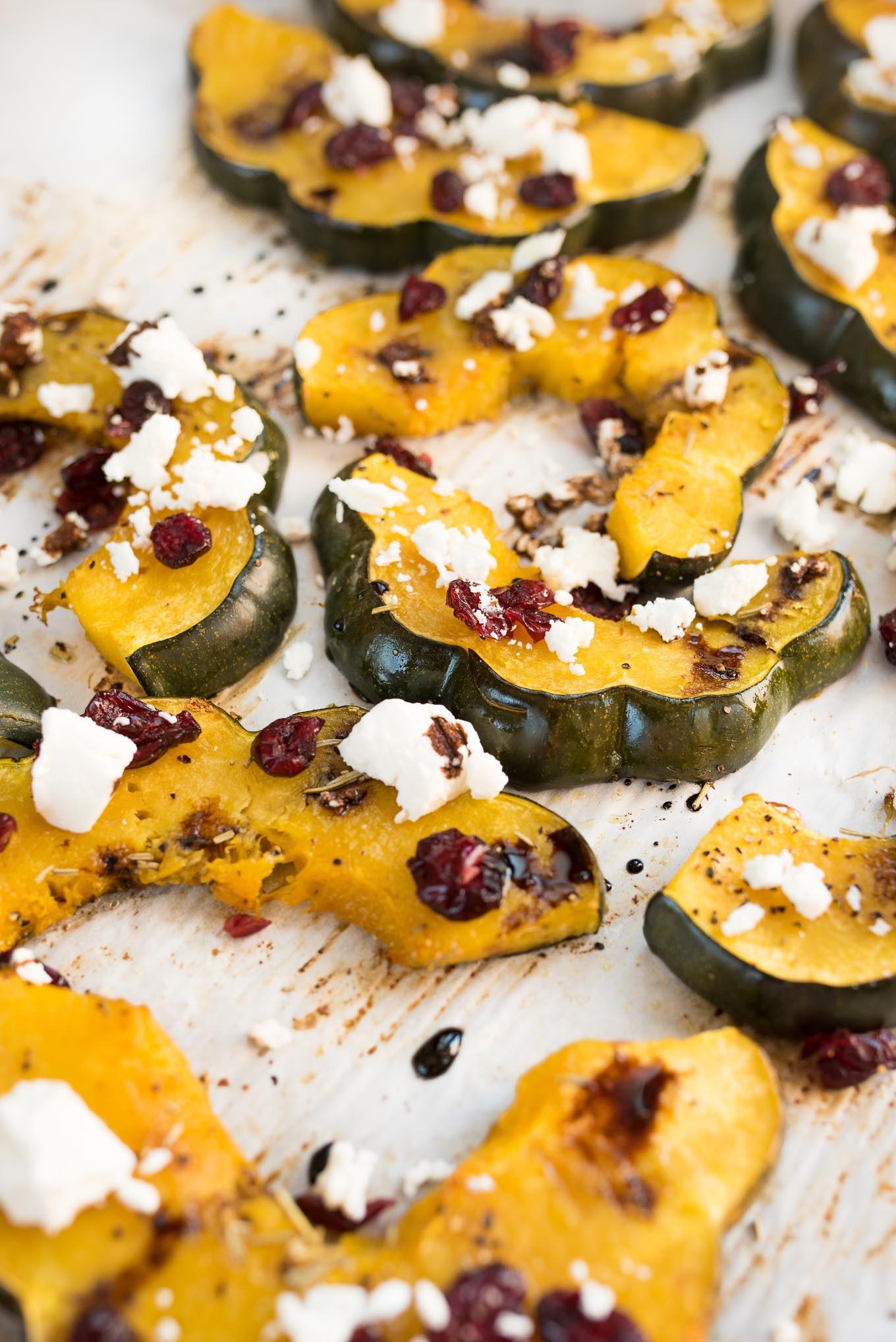 Roasted Acorn Squash with Cranberries, Goat Cheese and Balsamic Glaze #glutenfree #vegetarian side that will be perfect on your Holiday table | www.nutritiouseats.com