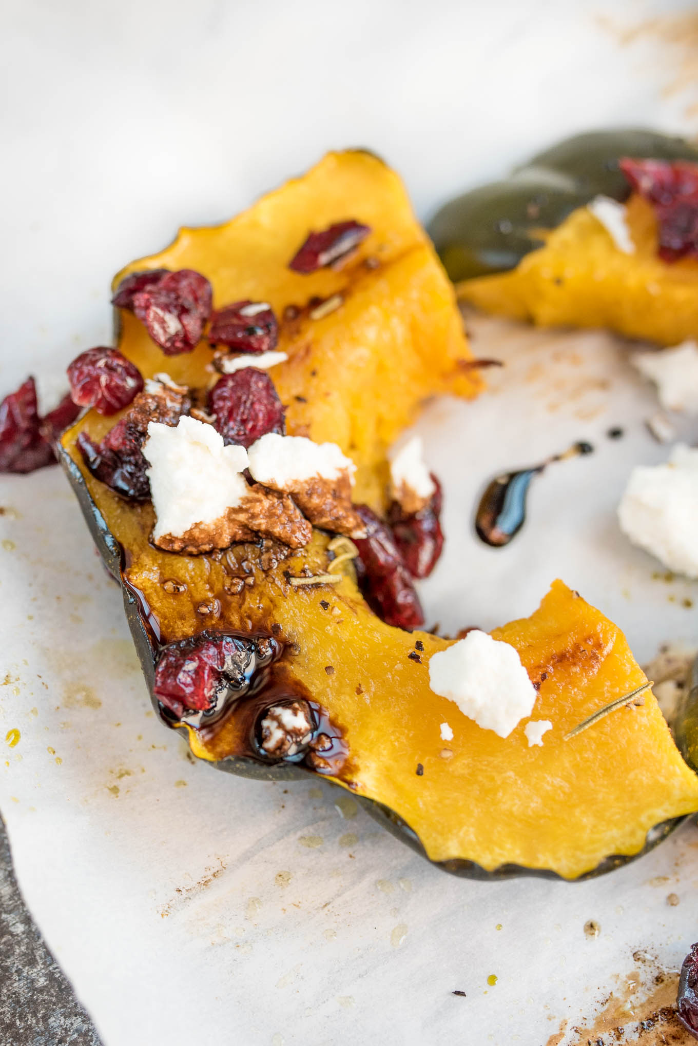 Roasted Acorn Squash with Cranberries, Goat Cheese and Balsamic Glaze #glutenfree #vegetarian side that will be perfect on your Holiday table | www.nutritiouseats.com 