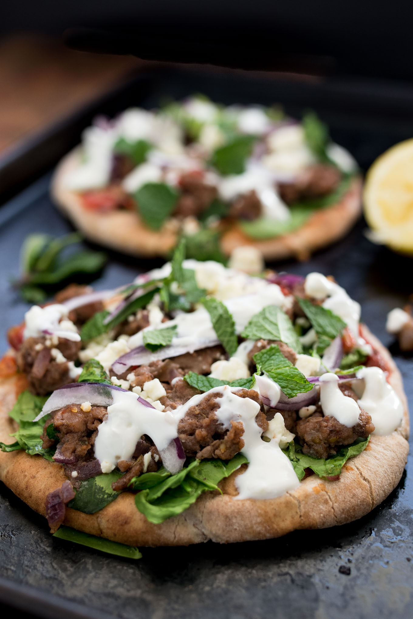 Lamb and Spinach Pita Pizza uses convenient pita bread for the crust and is flavor packed dish ready in under 30 minutes. 