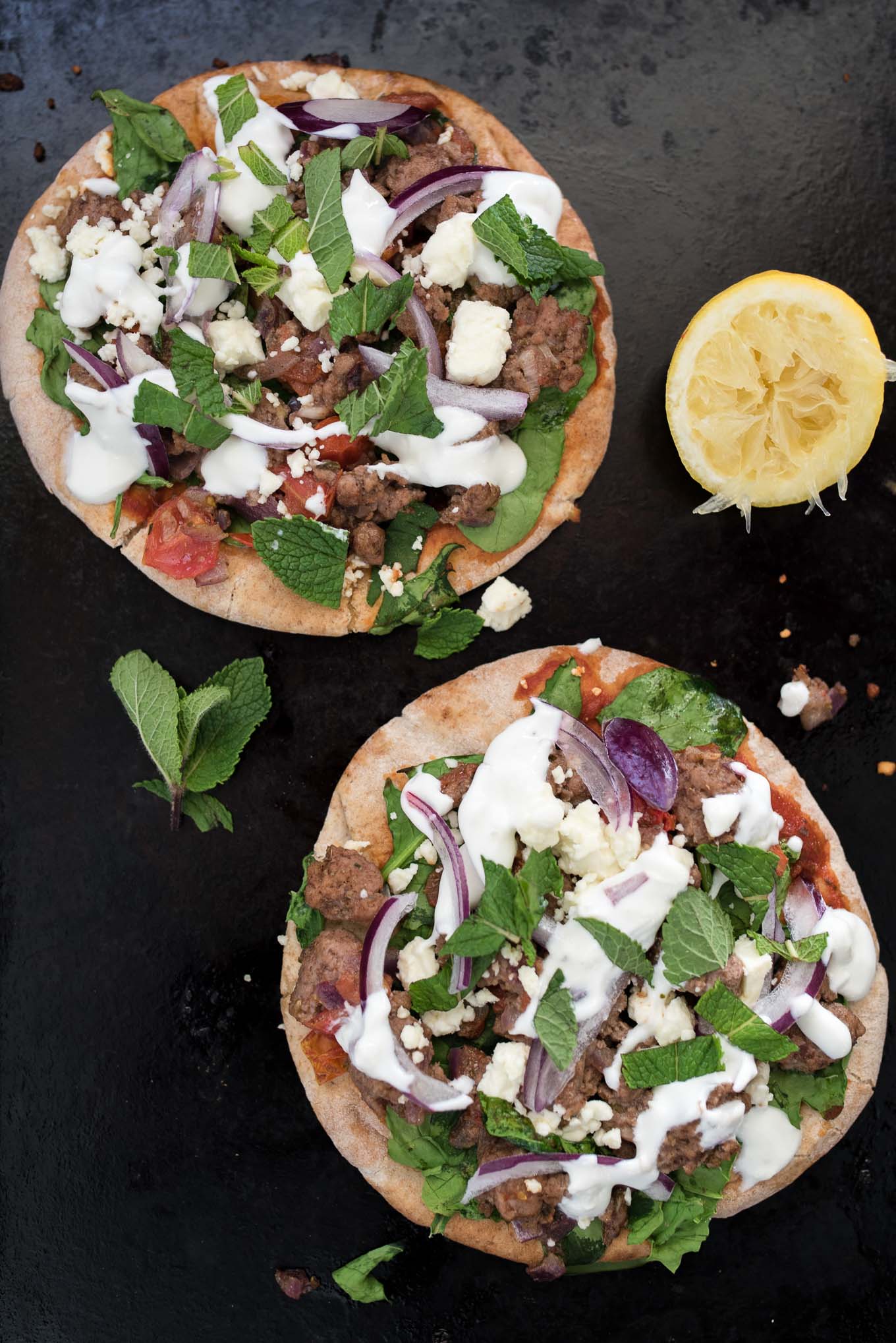Lamb and Spinach Pita Pizza uses convenient pita bread for the crust and is flavor packed dish ready in under 30 minutes. 