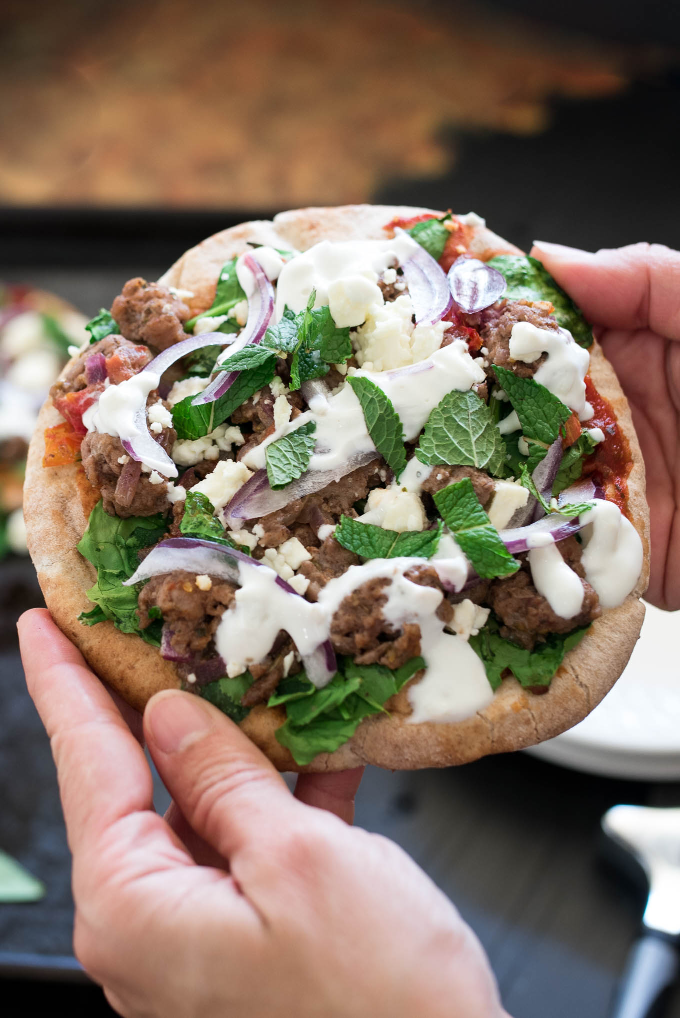 Lamb and Spinach Pita Pizza uses convenient pita bread for the crust and is flavor packed dish ready in under 30 minutes. 