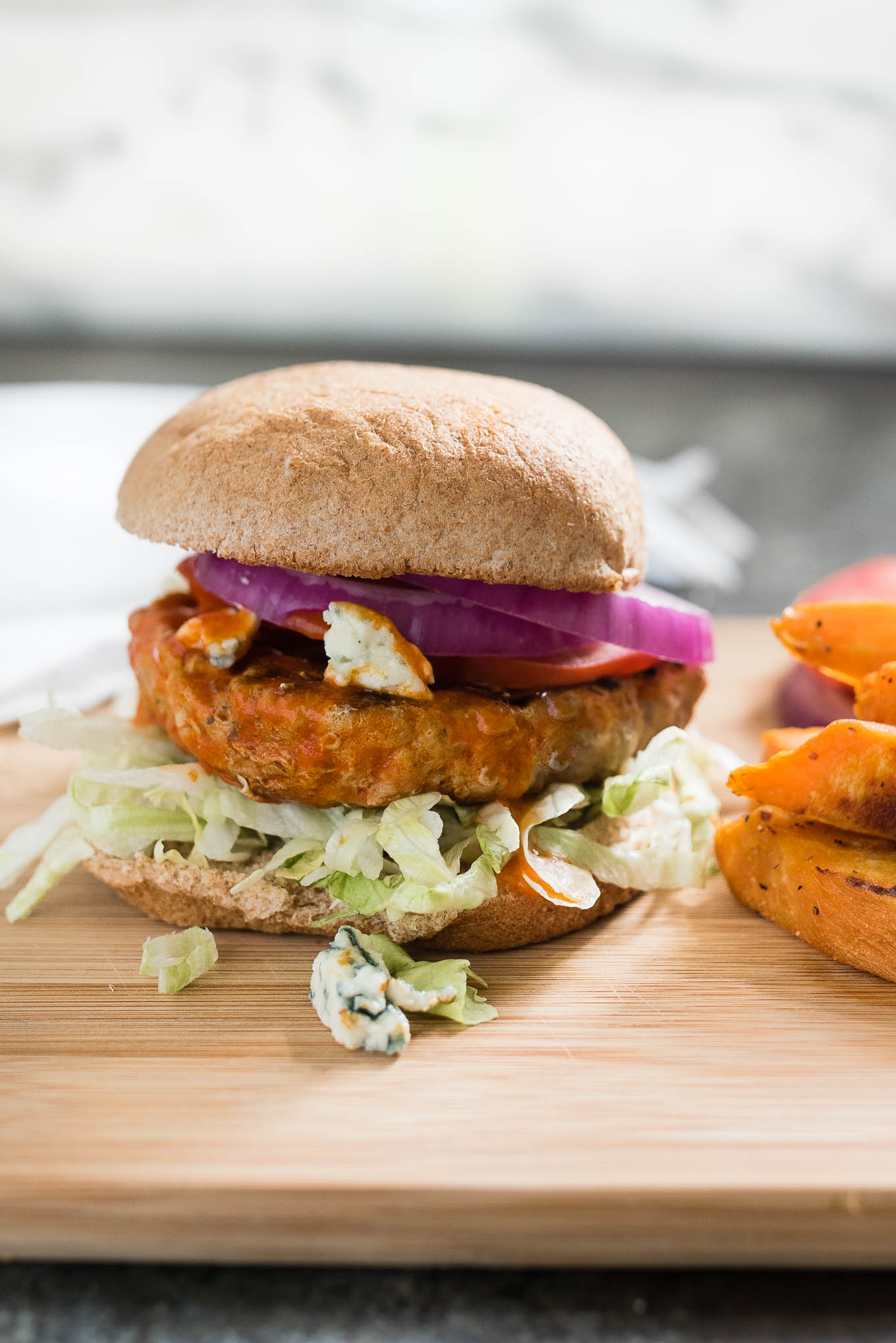 Skip the fried wings and make some easy and tasty Buffalo Turkey Burgers. For a low carb version serve them in lettuce wraps instead of on a bun!