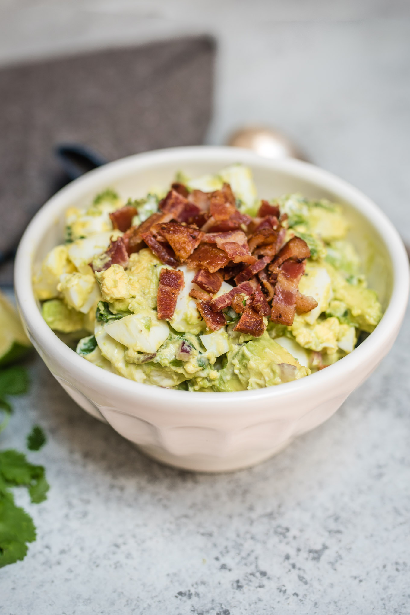 Guacamole Egg Salad tastes like that perfect guacamole recipe, but a little heartier with the addition of eggs and bacon. It makes a great dip, sandwich or salad topping.