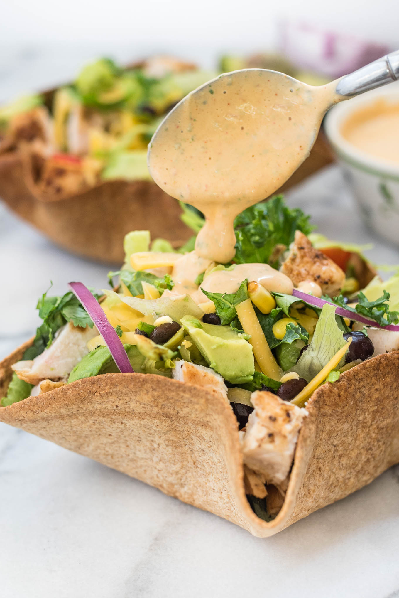 Chicken Taco Salad with Creamy Chipotle Dressing is delicious hearty salad, packed with flavor from the chicken, black beans, avocado and creamy spicy chipotle dressing.