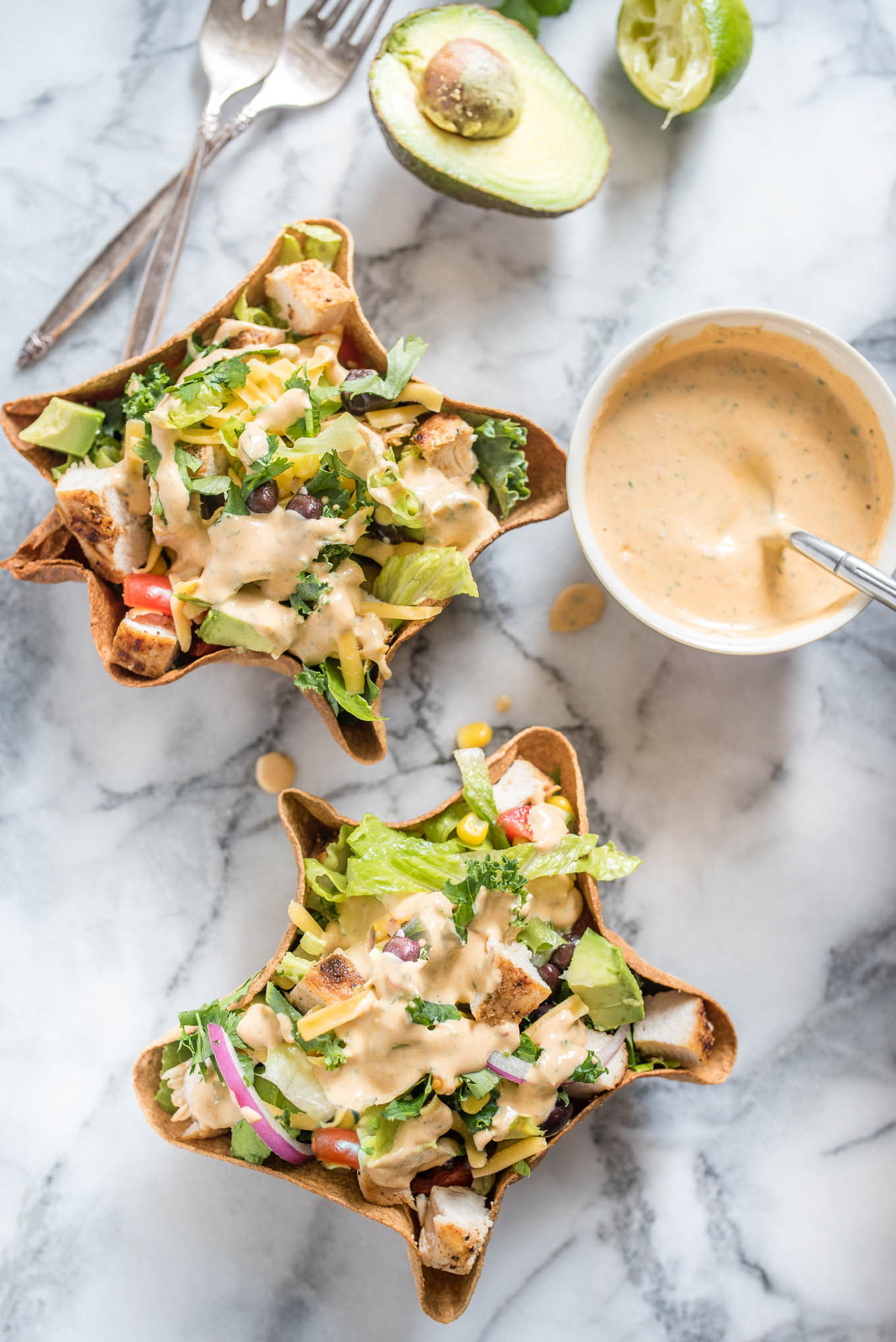 Chicken Taco Salad with Creamy Chipotle Dressing is delicious hearty salad, packed with flavor from the chicken, black beans, avocado and creamy spicy chipotle dressing.