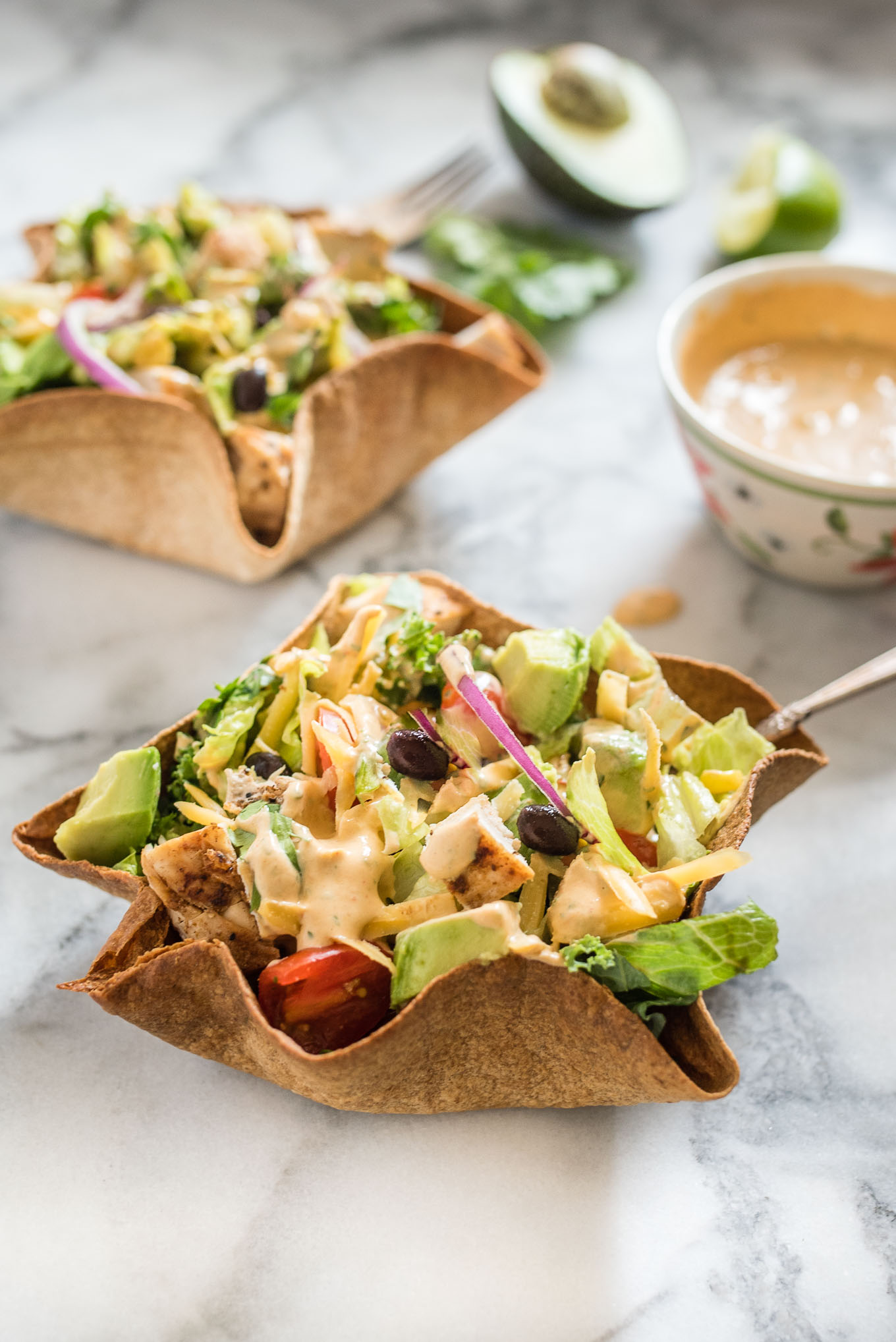 Chicken Taco Salad with Creamy Chipotle Dressing is delicious hearty salad, packed with flavor from the chicken, black beans, avocado and creamy spicy chipotle dressing.