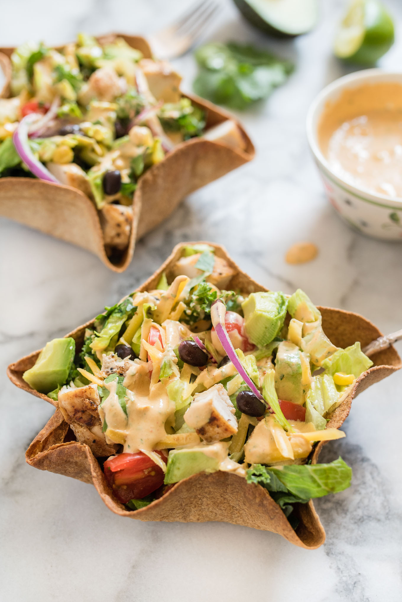 Chicken Taco Salad with Creamy Chipotle Dressing is delicious hearty salad, packed with flavor from the chicken, black beans, avocado and creamy spicy chipotle dressing.