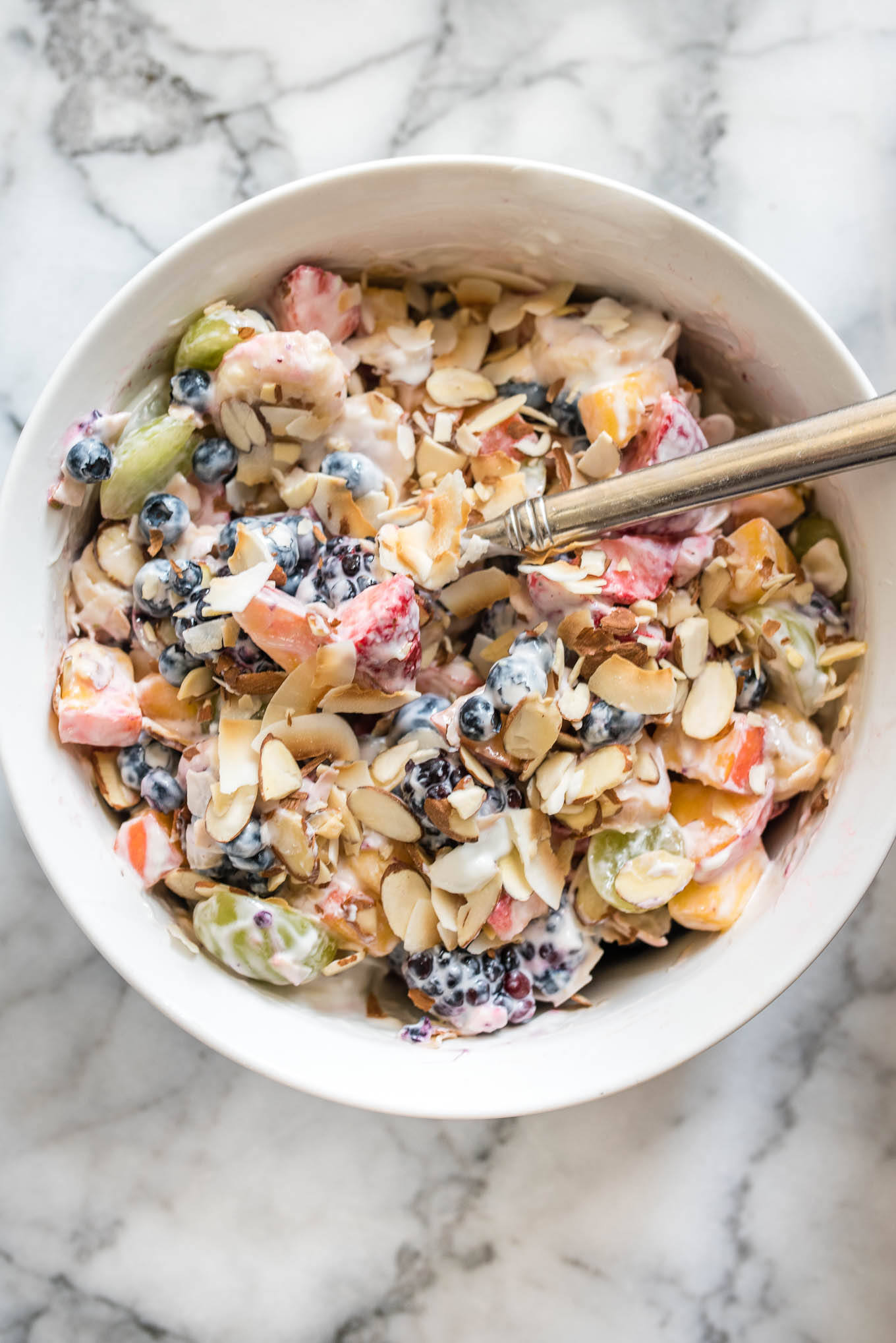 Fruit Salad with Lime Yogurt Dressing is a tangy sweet side dish and is a perfect gluten-free addition to a light breakfast, potluck or brunch.