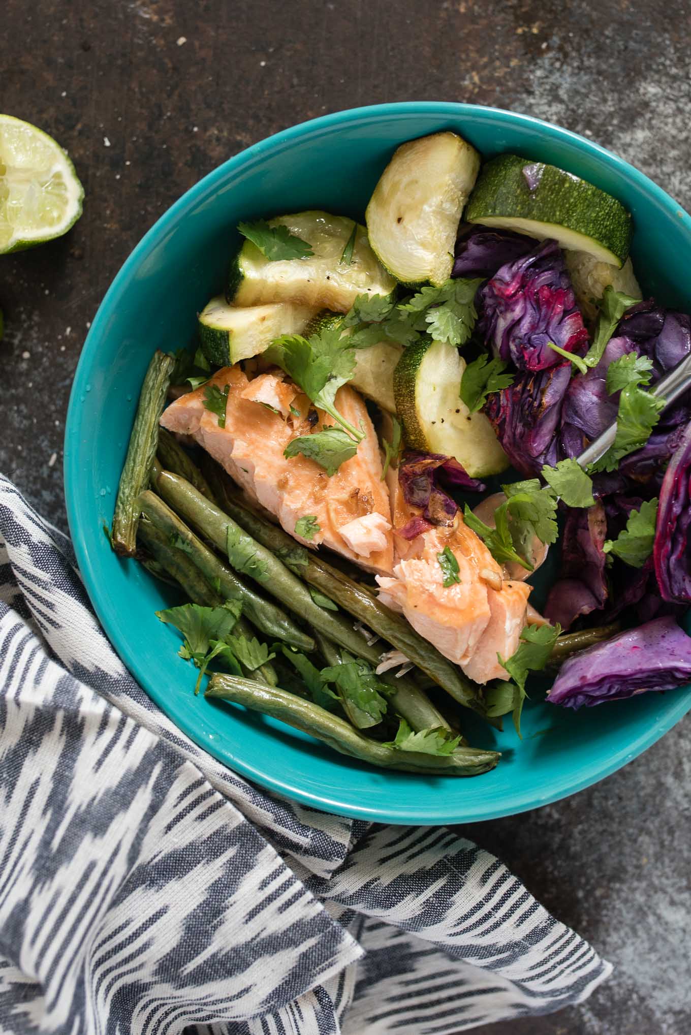 One Sheet Pan Asian Salmon and Veggies is for the healthy conscious salmon lover that wants an easy, tasty and healthy meal.