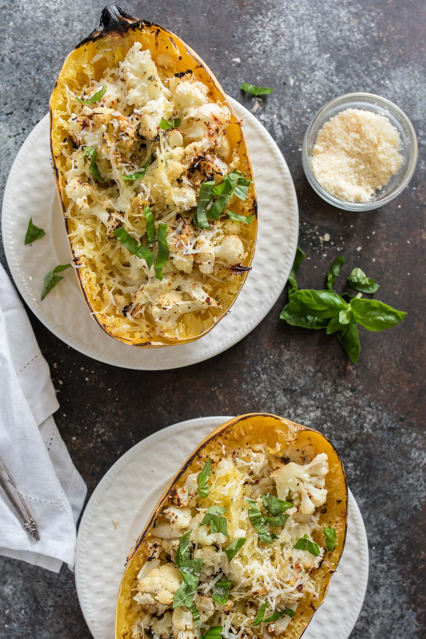 Cheesy Roasted Cauliflower Spaghetti Squash Boats make a great vegetarian meal or side dish, packed with garlicky cauliflower and cheesy goodness.