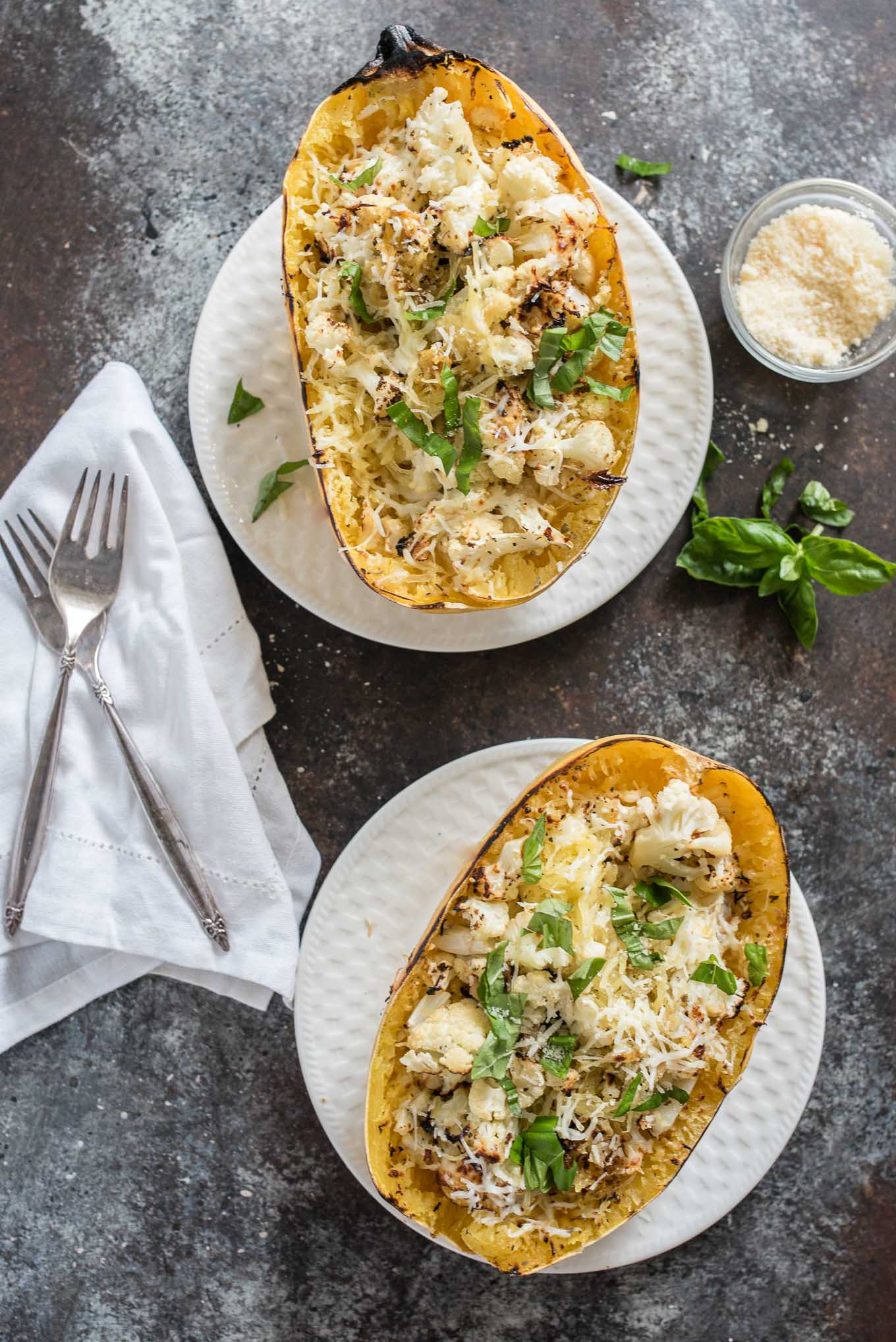 Cheesy Roasted Cauliflower Spaghetti Squash Boats make a great vegetarian meal or side dish, packed with garlicky cauliflower and cheesy goodness.