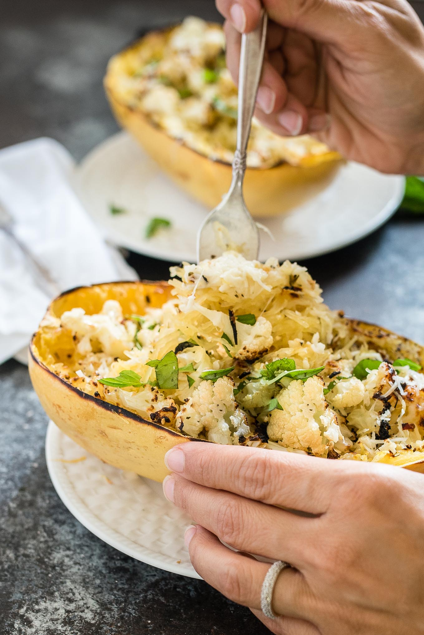 Cheesy Roasted Cauliflower Spaghetti Squash Boats make a great vegetarian meal or side dish, packed with garlicky cauliflower and cheesy goodness.