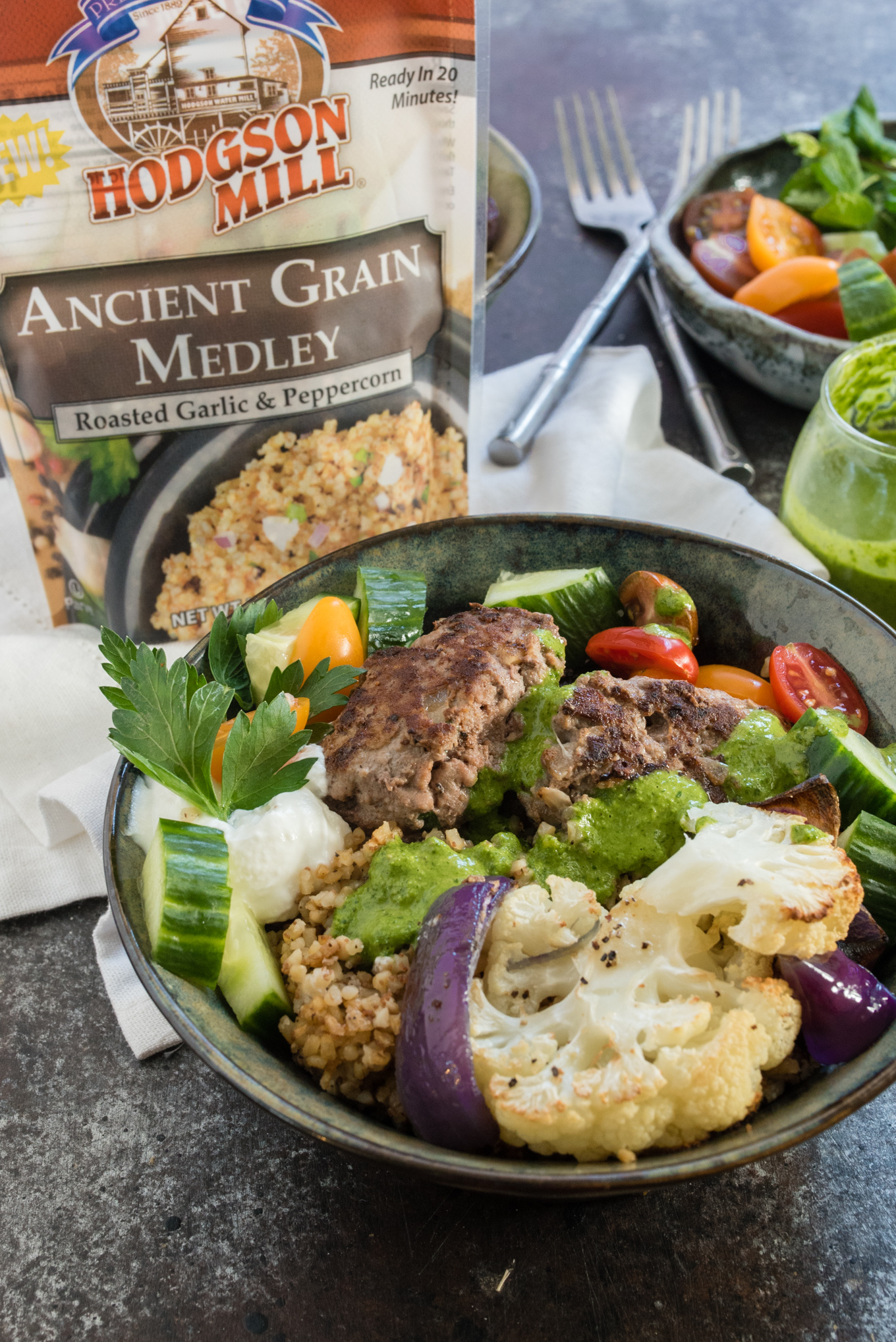 This Beef and Grain Kofta bowl takes Middle Eastern inspired meatballs and pairs them with a hearty flavorful grain and some veggies for a nutrition packed meal!