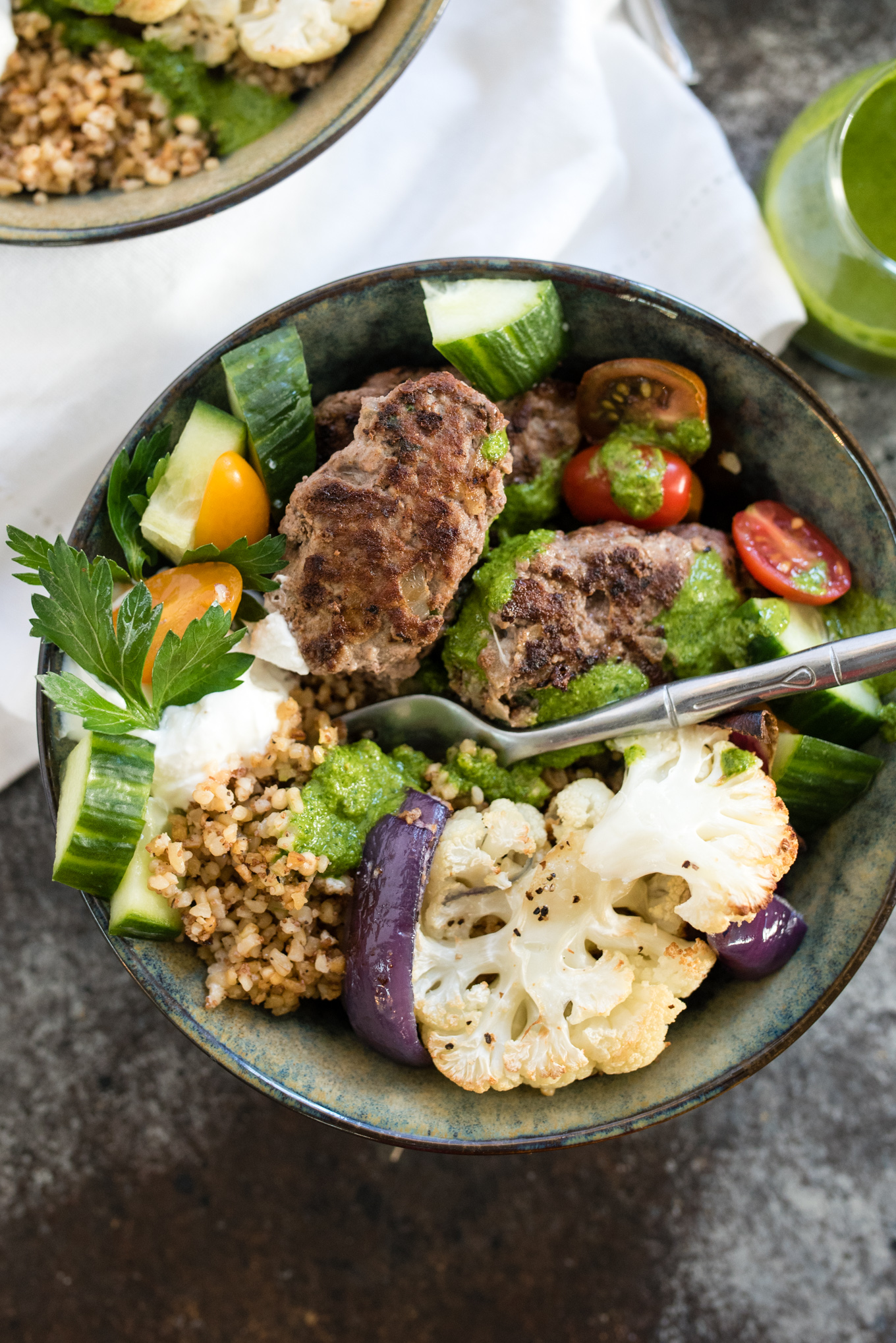 This Beef and Grain Kofta bowl takes Middle Eastern inspired meatballs and pairs them with a hearty flavorful grain and some veggies for a nutrition packed meal!