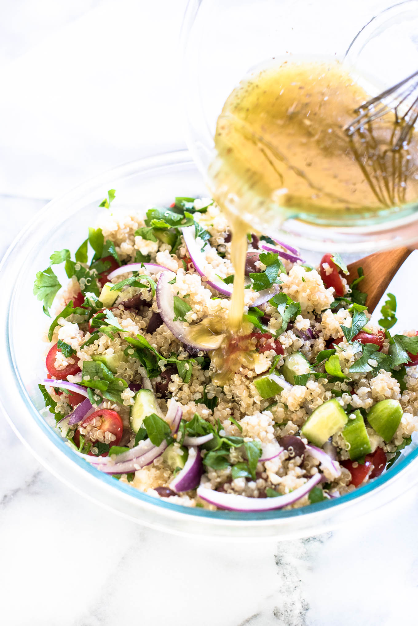 Greek Quinoa Salad is bursting with Mediterranean flavors and is a great make-ahead vegetarian and gluten free salad.