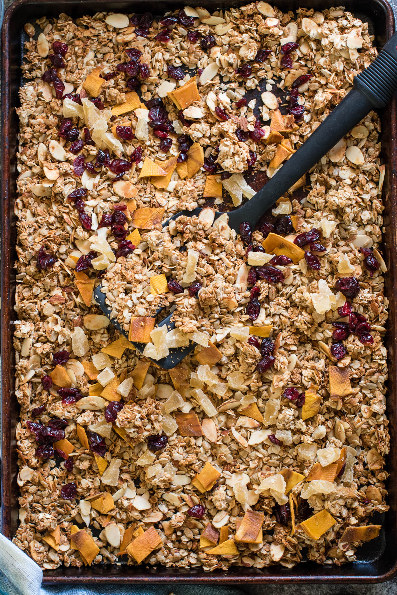 Serve this Easy Homemade Granola with milk, over Greek yogurt or straight from the tin for a healthy breakfast or snack! Made with rolled oats, coconut, seeds, nuts and fruit- the perfect combo! 