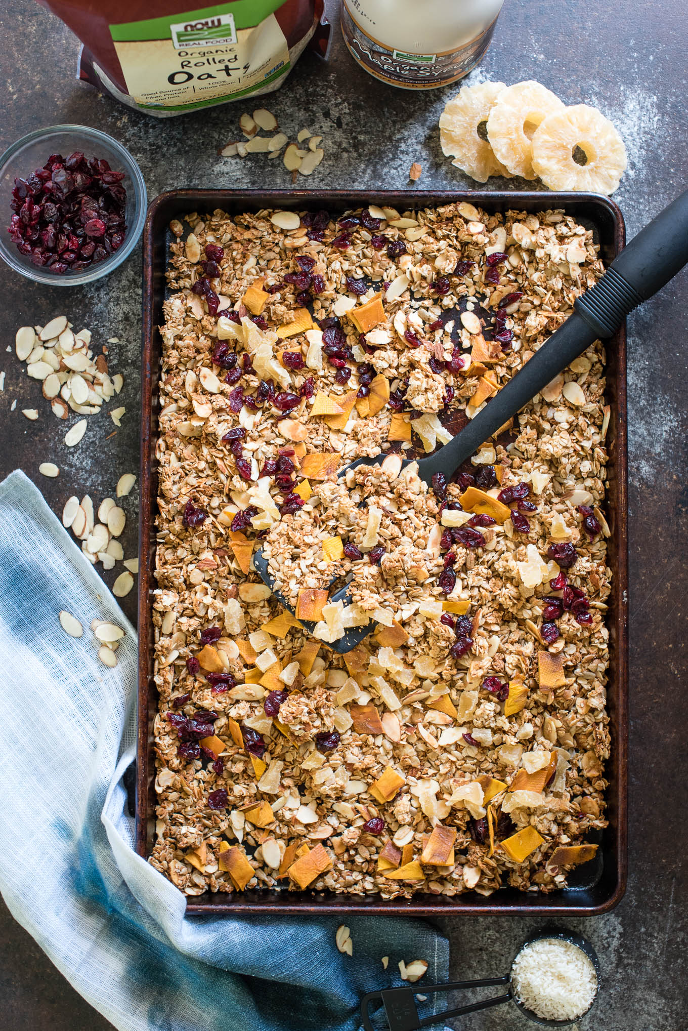 Serve this Easy Homemade Granola with milk, over Greek yogurt or straight from the tin for a healthy breakfast or snack! Made with rolled oats, coconut, seeds, nuts and fruit- the perfect combo! 