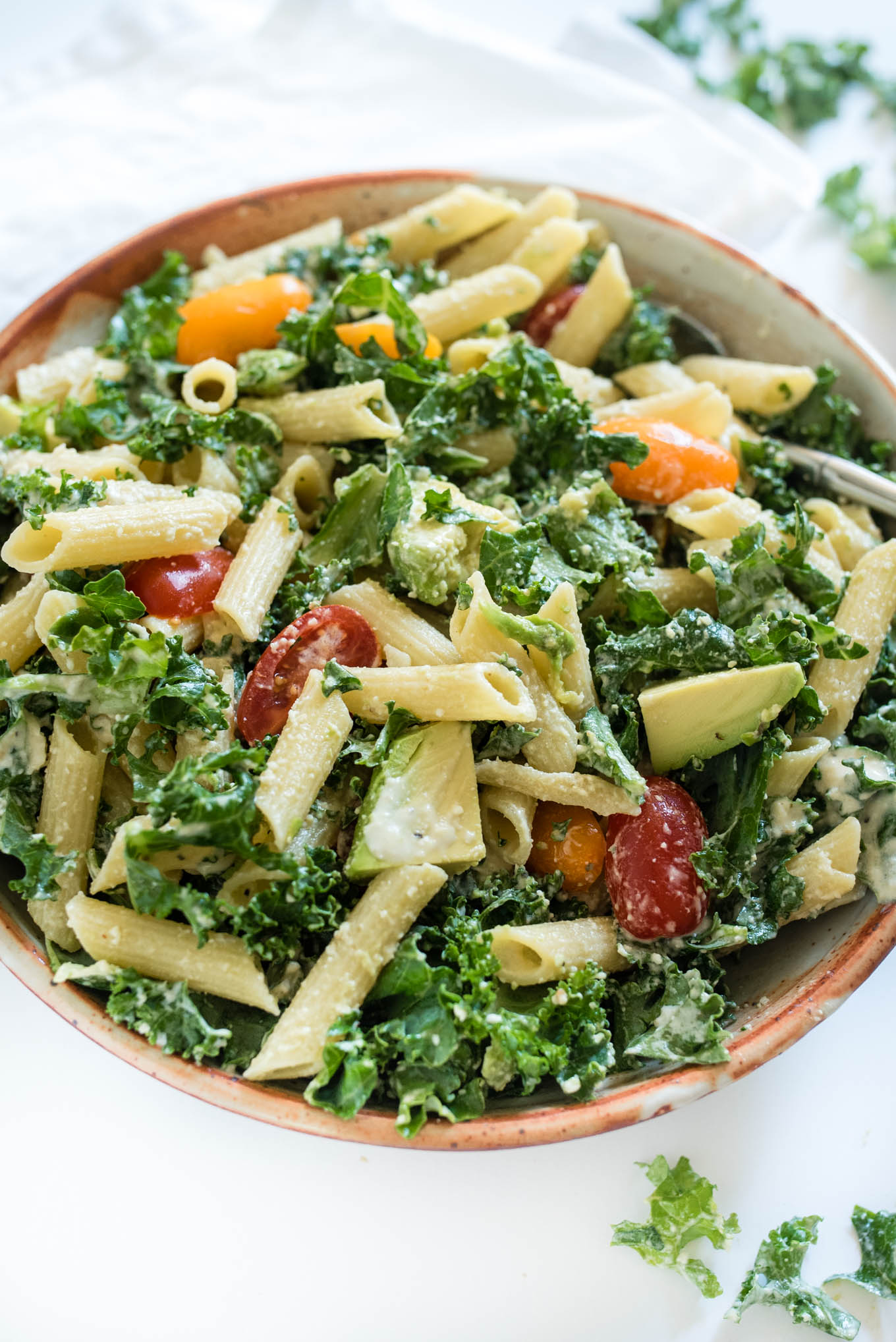 Kale Caesar Pasta Salad is a great vegetarian pasta salad packed with kale, avocado and a simple homemade Caesar dressing. 