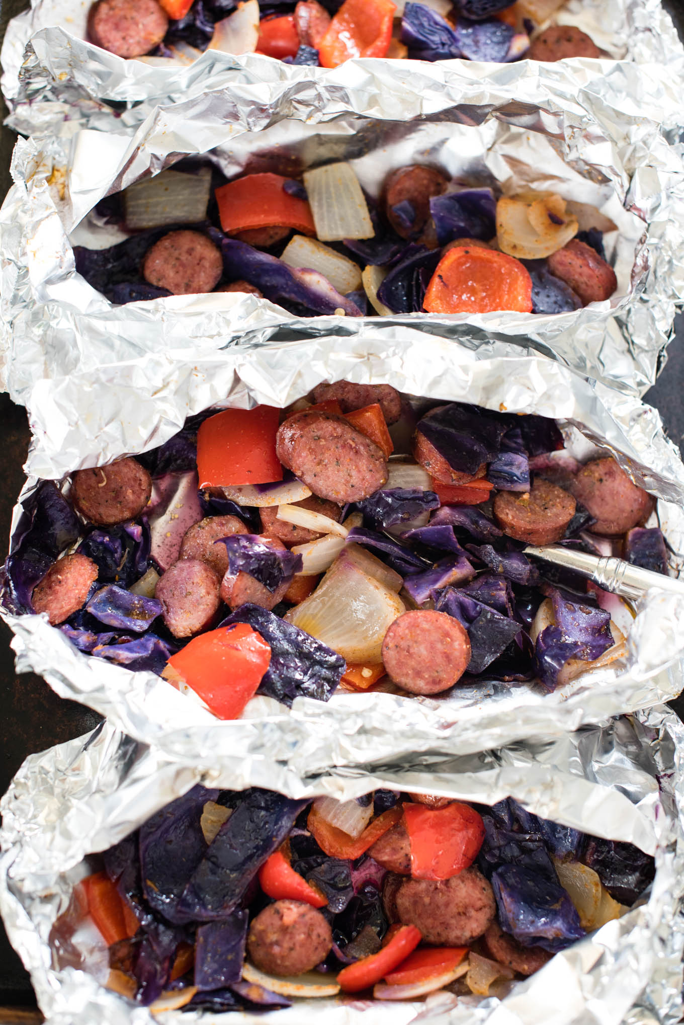 Cajun Sausage and Vegetable Foil Packets can be assembled in less than 10 minutes, and are protein rich, fiber packed and gluten free. 