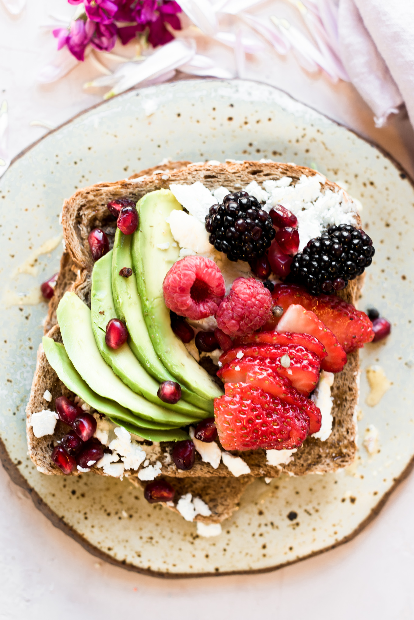 toast with avocado and berries