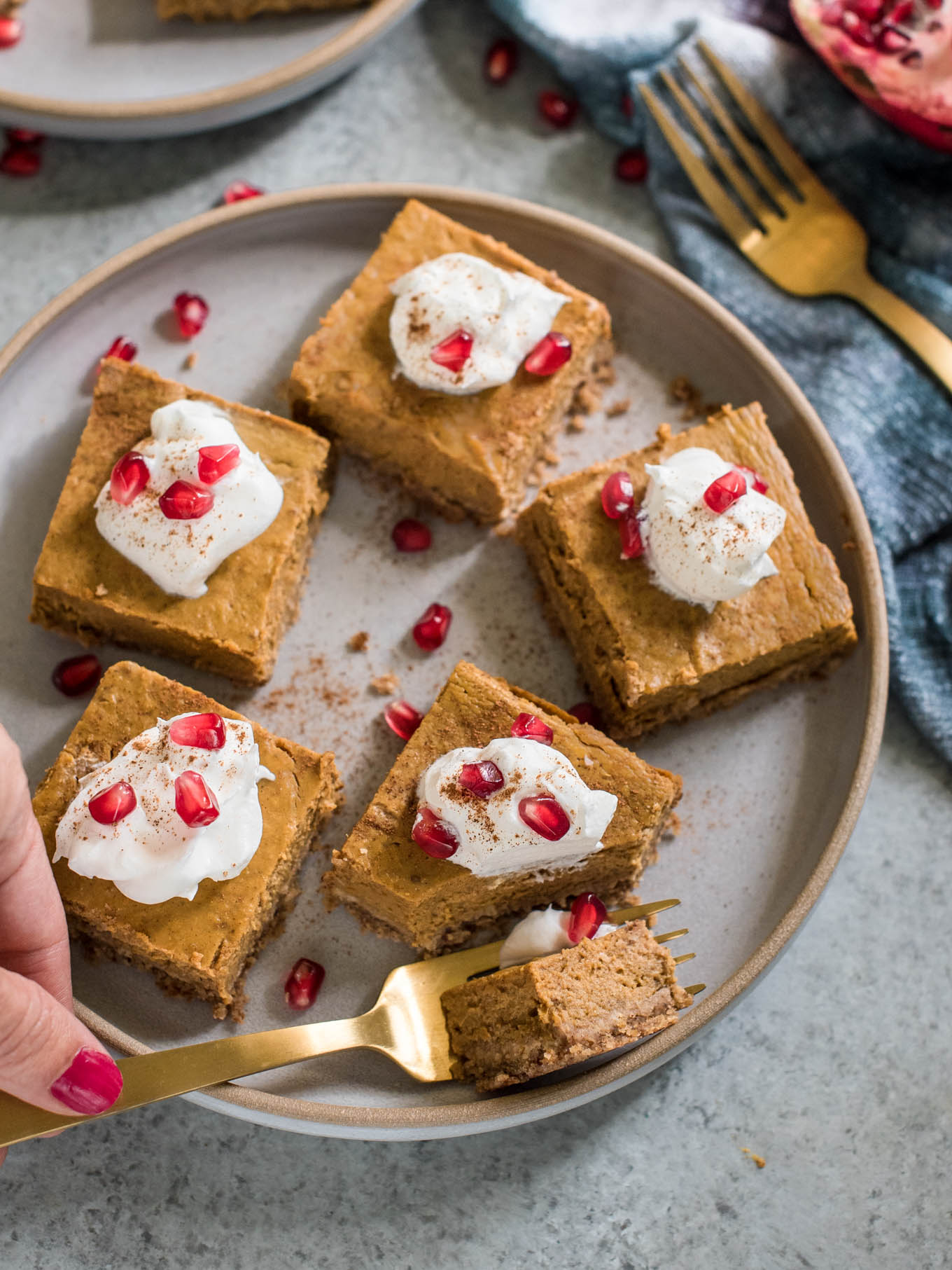 Bite of pumpkin pie bar on a plate