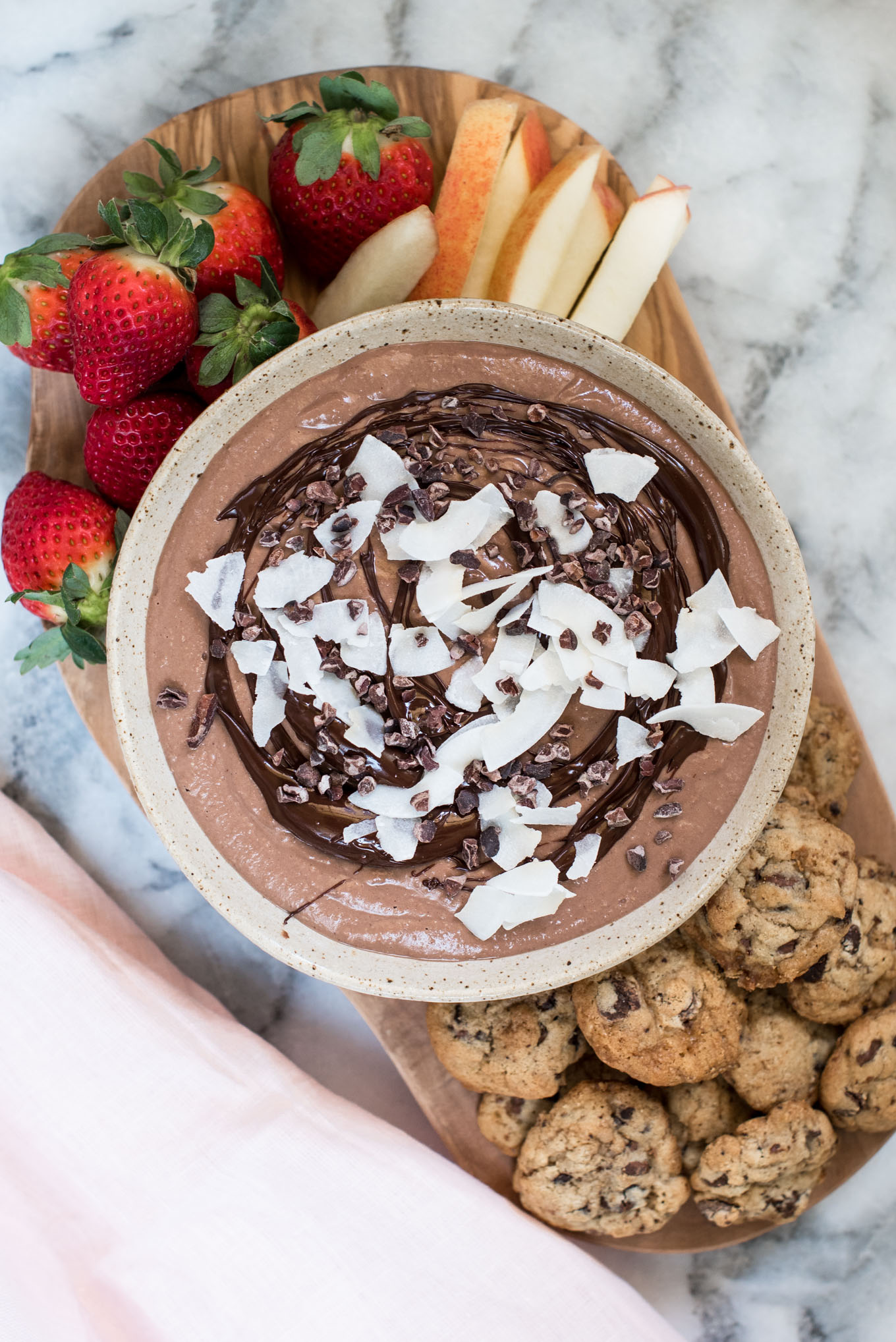 bowl of chocolate hummus with fruit and cookies