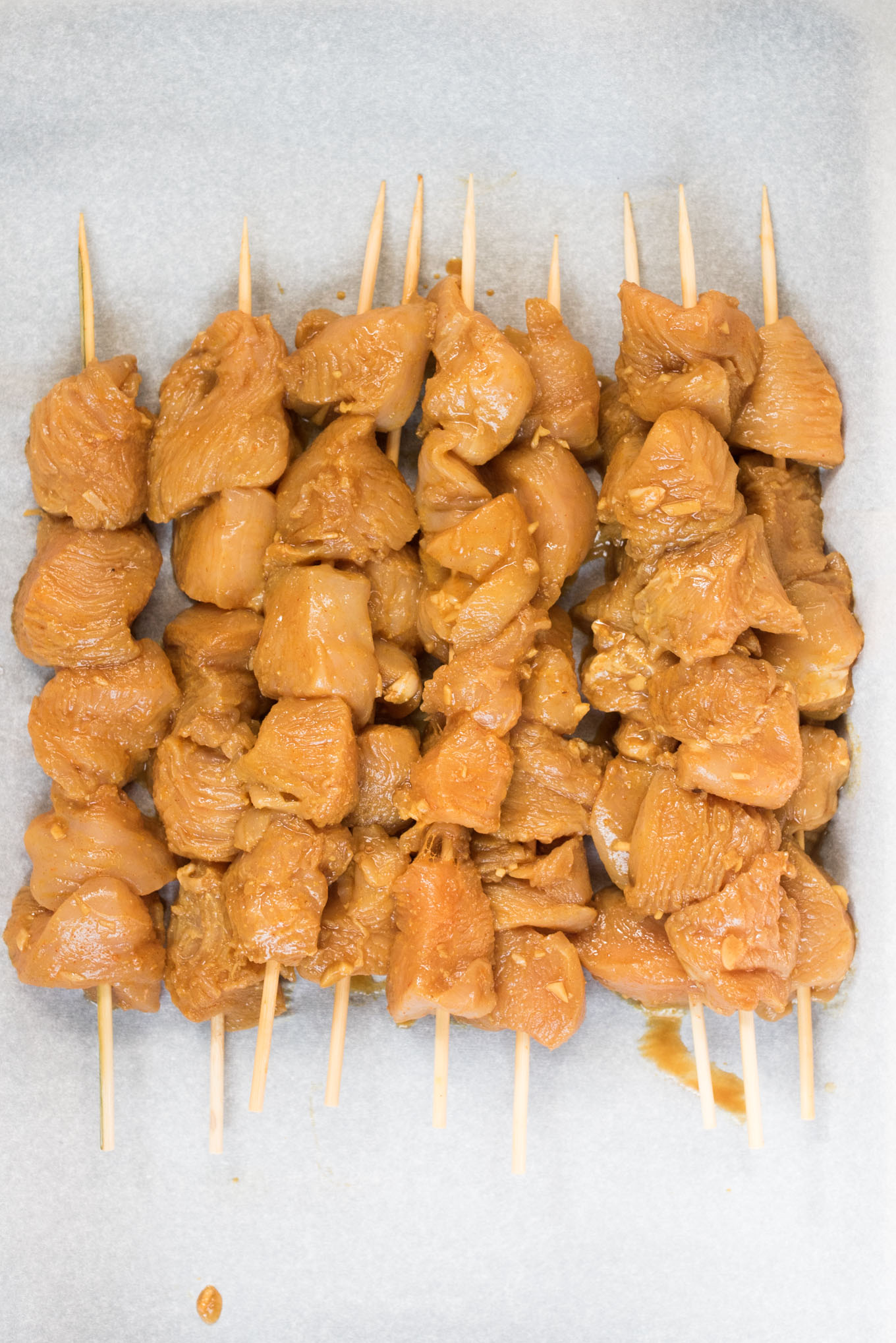 Marinated raw chicken skewers 