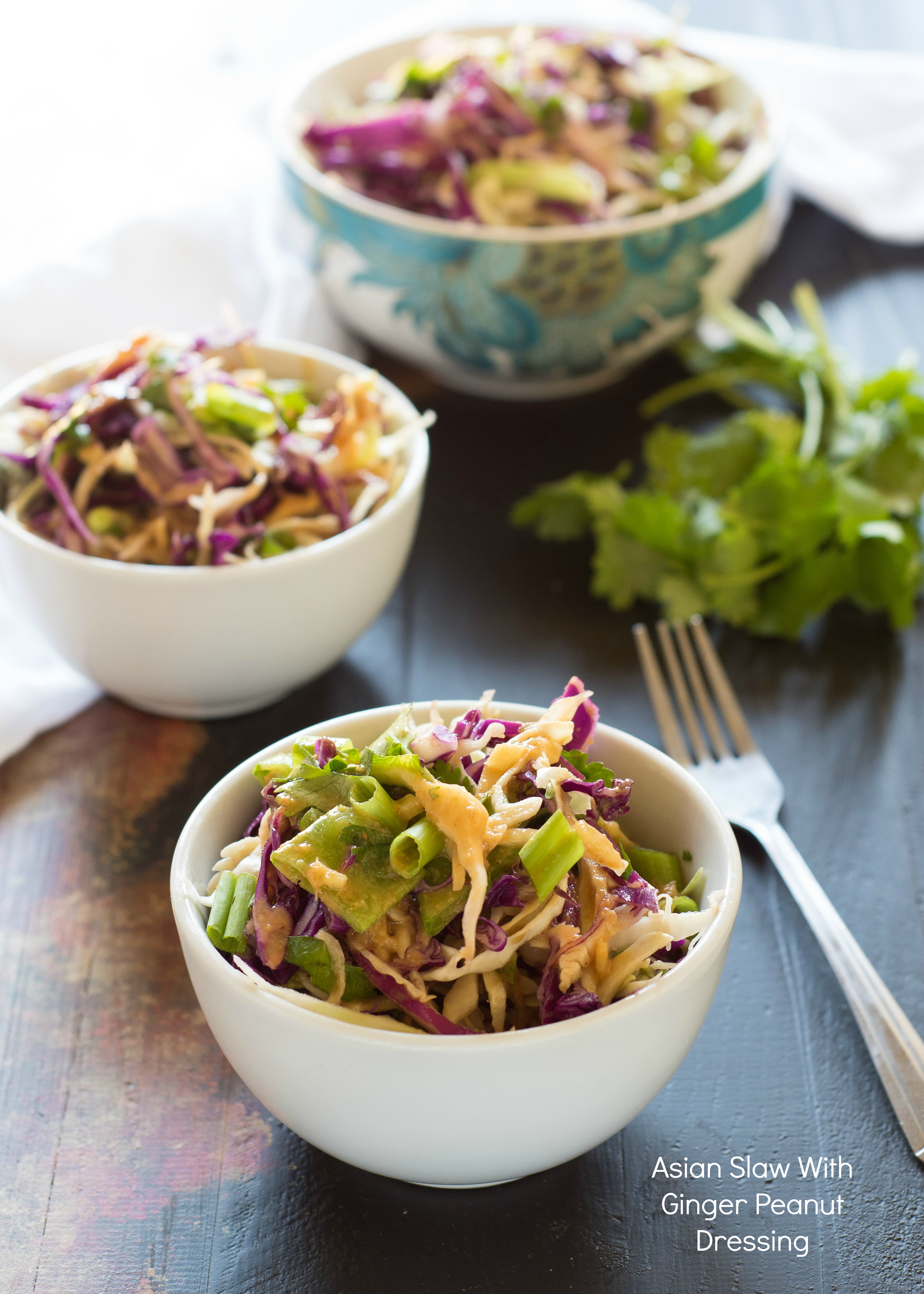 Asian Slaw With Ginger Peanut Dressing- this slaw packs a ton of flavor with the soy ginger peanut dressing. You will love it! | Nutritious Eats