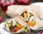 Mediterranean Chicken Wrap- Greek Salad, hummus and seasoned chicken make up this tasty wrap. Great for leftovers or a make-ahead meal! | www.nutritiouseats.com