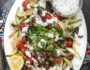 Loaded Mediterranean Fries- Truffle Fries loaded with veggies and Mediterranean flavors like feta, oregano and tzatziki sauce #glutenfree #vegetarian | www.nutritiouseats.com