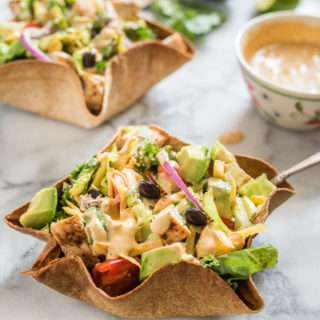 Chicken Taco Salad with Creamy Chipotle Dressing is delicious hearty salad, packed with flavor from the chicken, black beans, avocado and creamy spicy chipotle dressing.