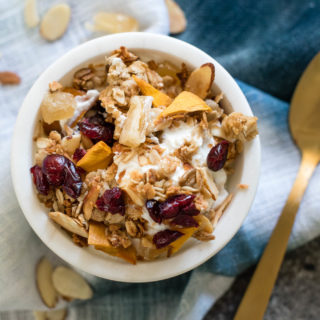 Serve this Easy Homemade Granola with milk, over Greek yogurt or straight from the tin for a healthy breakfast or snack! Made with rolled oats, coconut, seeds, nuts and fruit- the perfect combo!