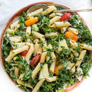 Kale Caesar Pasta Salad is a great vegetarian pasta salad packed with kale, avocado and a simple homemade Caesar dressing.